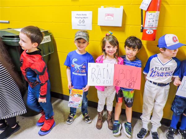 Students and teachers dressing up for a vocabulary parade. 